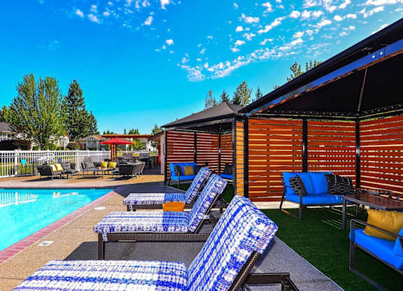 pool with lounge chairs at Clock Tower Village, Washington
