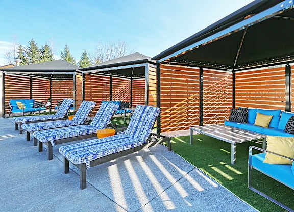 pool with lounge chairs at Clock Tower Village, DuPont, 98327