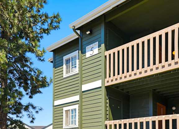 A green building with the number 5 on it.