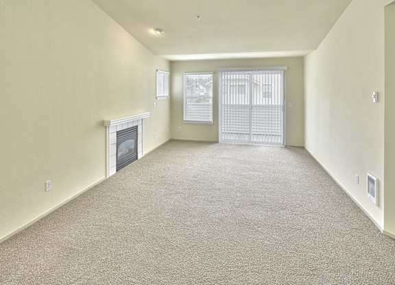 living area with fireplace and attached balcony at Clock Tower Village, DuPont, WA 98327