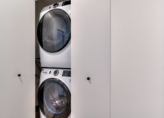 a washing machine and dryer in a laundry closet