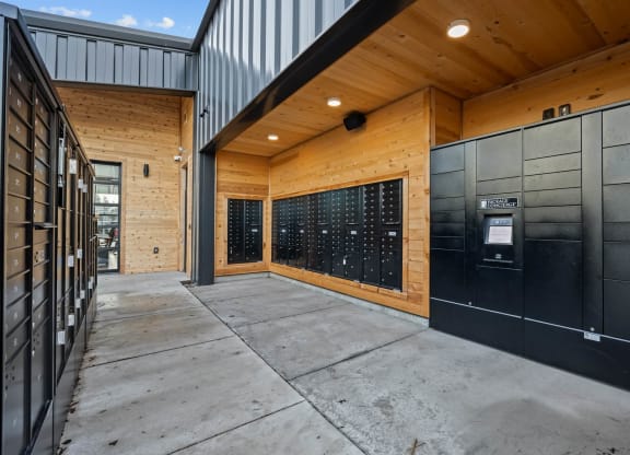 the front door of a building with a sidewalk and a parking meter
