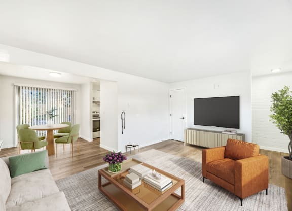 a living room with a couch and a table and a television
