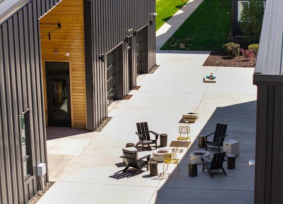 A patio area with a table and chairs is shown.