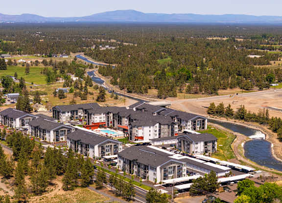 A large residential complex with a river running through it.
