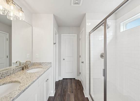 Primary Bathroom with double vanity and walk-in shower