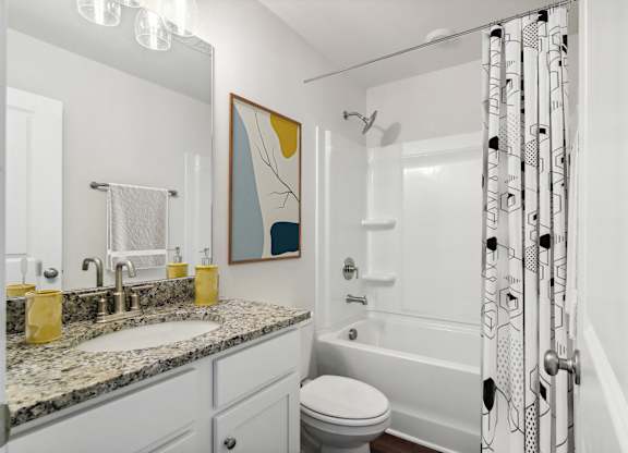 Secondary suite bathroom with a tub and shower combination