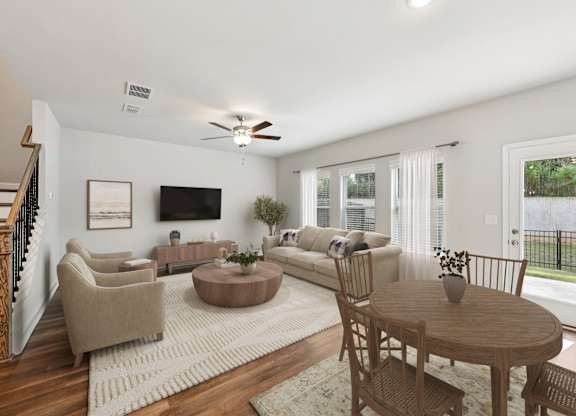 Living room with large window letting in a ton of natural light.