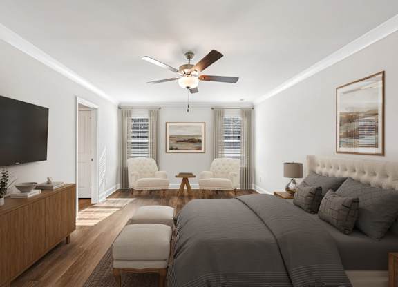 Primary Bedroom with king size bed and large window letting in nice natural light.