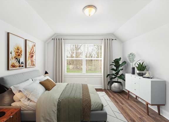 A bedroom with a bed, nightstand, and a plant.