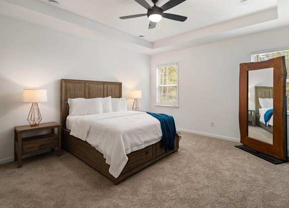 Primary Bedroom with king size bed and large window letting in nice natural light.