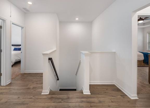 Hallway and stairwell guiding you up to the loft area.