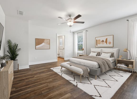 4-bedroom rental with large primary bedroom. Offers room for a king size bed with tons of natural light from the oversized windows. There is a ceiling, attached walk-in closet &