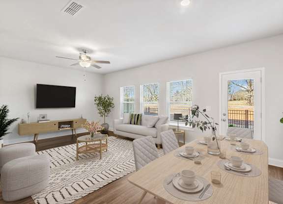Living room with large window letting in a ton of natural light.