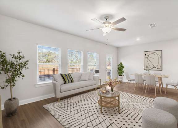 A view of the living room and intimate dining space