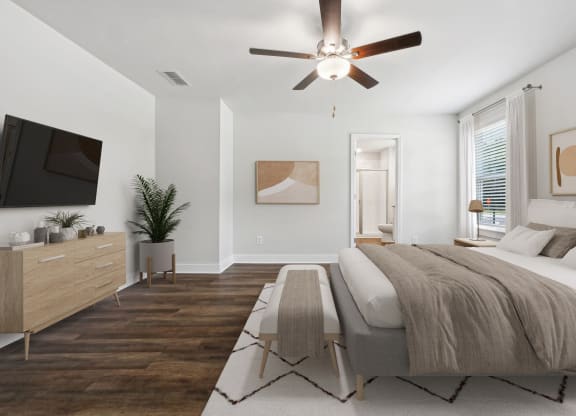 4-bedroom rental with large primary bedroom. Offers room for a king size bed with tons of natural light from the oversized windows. There is a ceiling, attached walk-in closet &