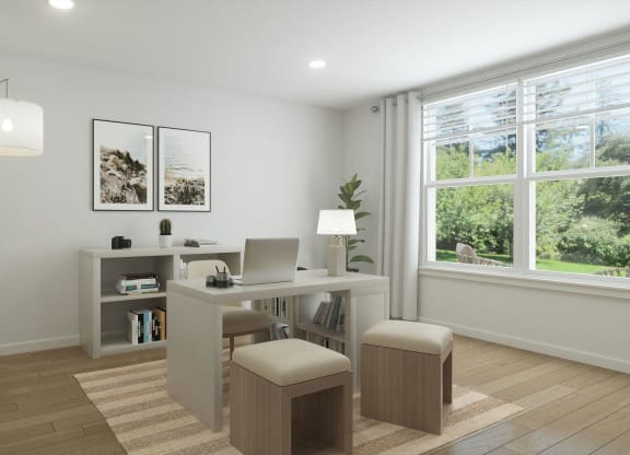 a home office with a desk and a laptop