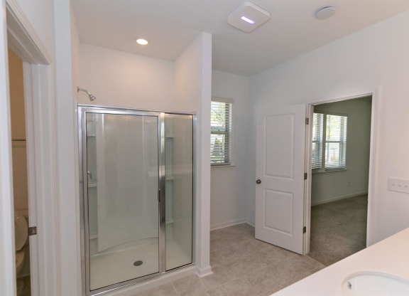 a bathroom with a shower and a sink