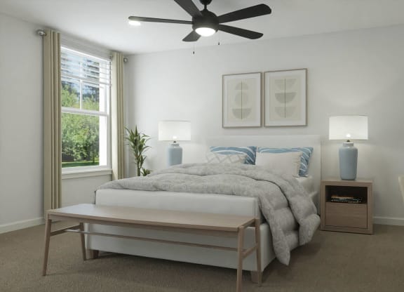 a bedroom with a bed and a ceiling fan