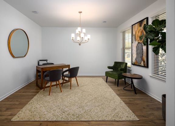 a dining room with a table and chairs and a chandelier