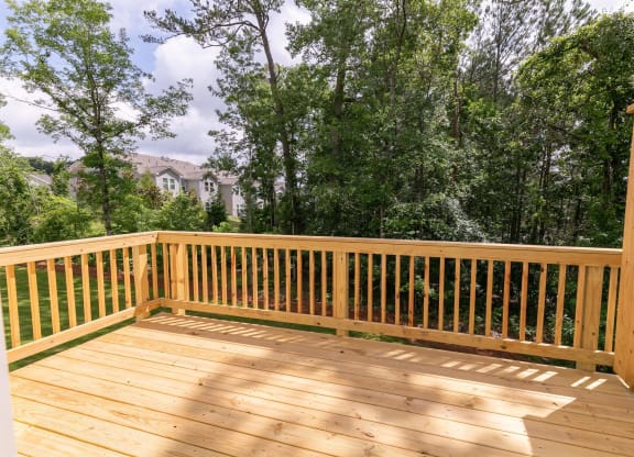 the deck has a view of the trees