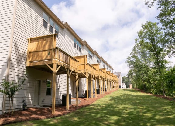 a row of houses with wooden decks
