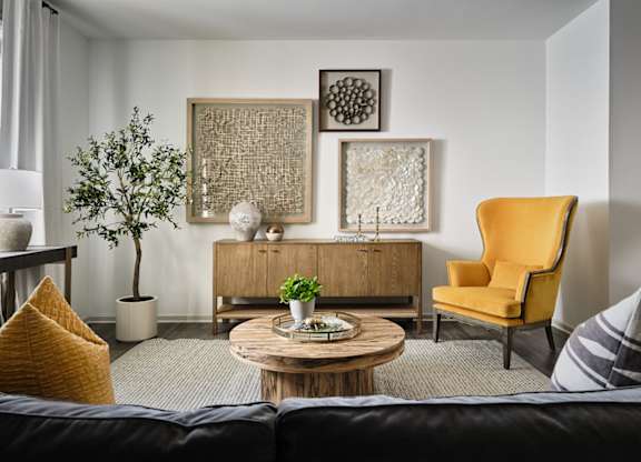 Living room with large window letting in a ton of natural light.