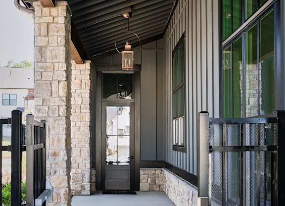 Front porch of the Clubhouse featuring a black ceiling and inviting entryway.
