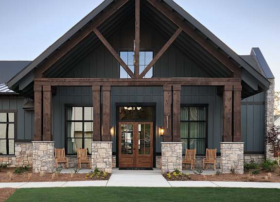Clubhouse exterior with ample parking for future residents and visitors.