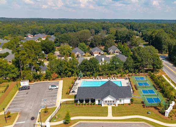 Bird’s-eye view showcasing the clubhouse and surrounding amenities.