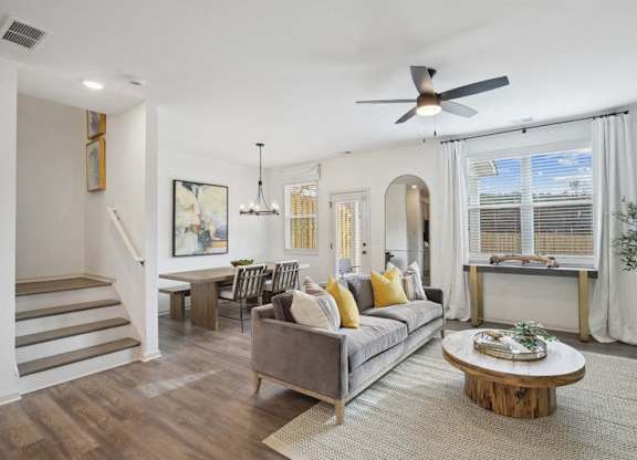 Spacious living area with easy access to the stairwell and upper levels.