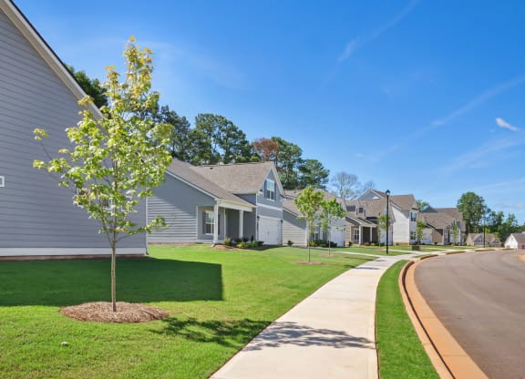 a row of houses on the side of a street