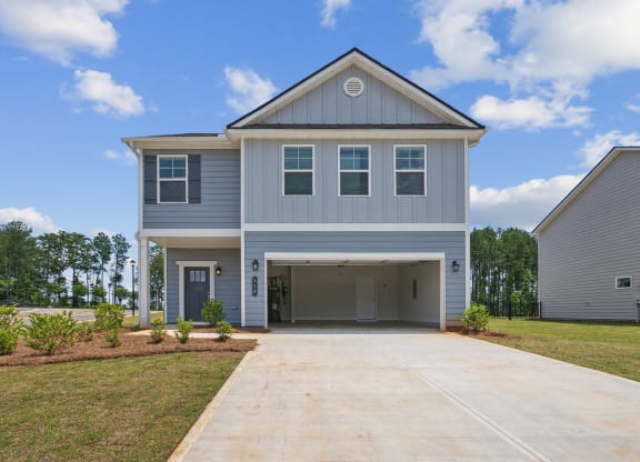 4-bedroom single family home rental - attached 2 car garage and fenced in backyard.