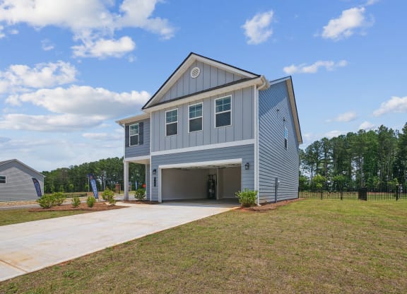 4-bedroom single family home rental - attached 2 car garage and fenced in backyard.