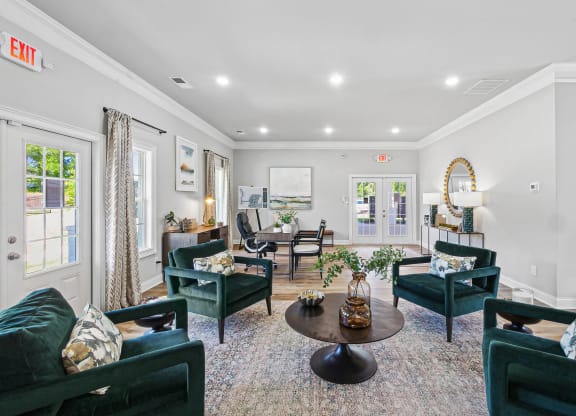 a living room with couches and chairs and a table
