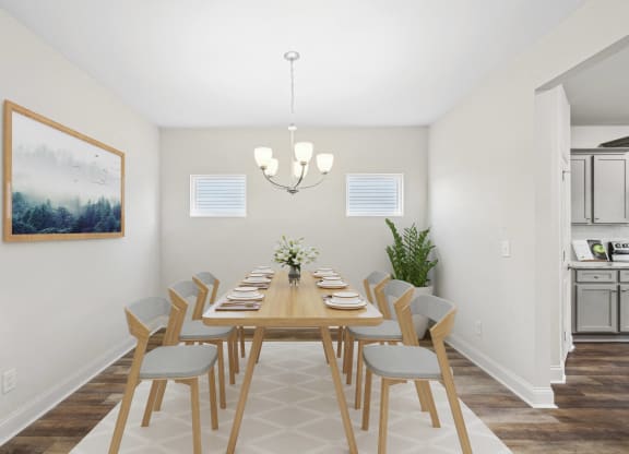 a dining room with a long wooden table and chairs