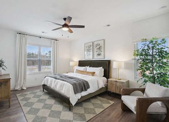 Spacious and calming primary suite with refined décor, a king bed, and nature-inspired accents.