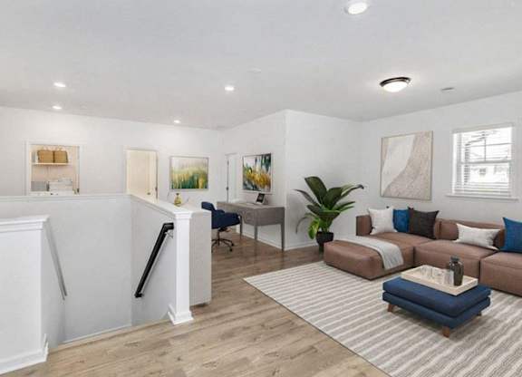 Loft area ideal for family gatherings just steps from the upstairs bedrooms.