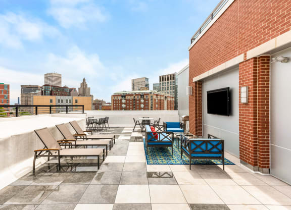 rooftop of station row with sun chairs and tv