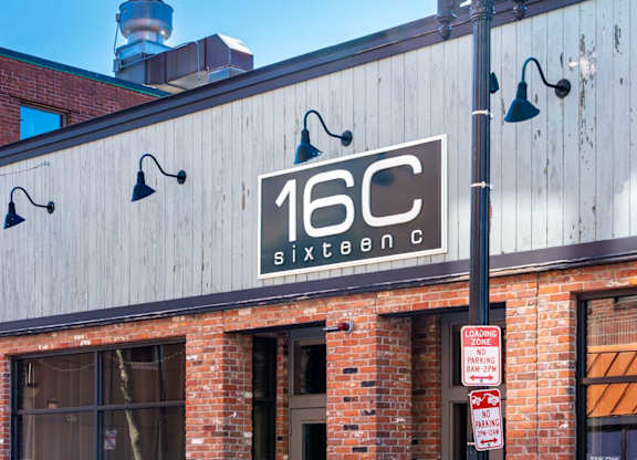 A building with a sign that says 16C.