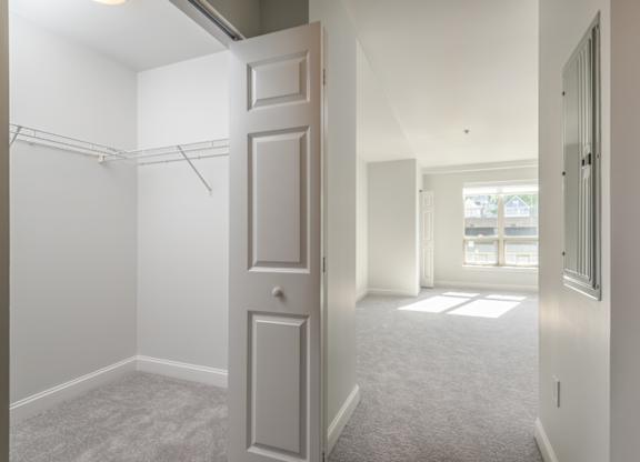 View of the first bedroom with oversized closets in Munroe Place in Quincy, MA