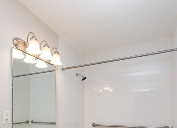 Quincy commons one bedroom bathroom with bright white clean finishes