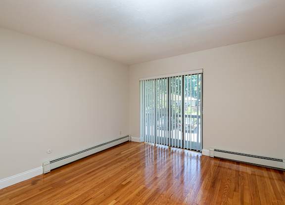 Quincy Commons one bedroom apartment with wood flooring and balcony