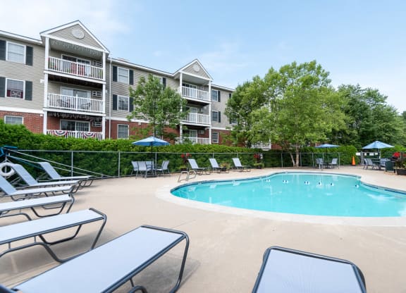 pool deck and foliage with umbrellas