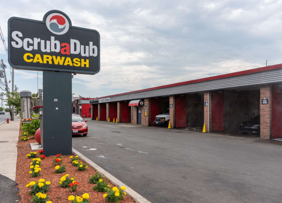 The exterior of Scrub-a-Dub Car Wash, a well-maintained facility offering car cleaning services.