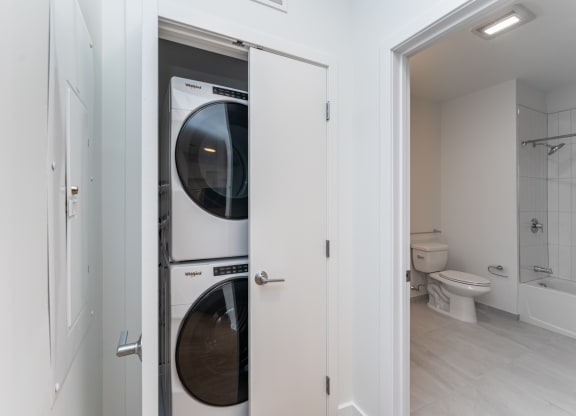 a washer and dryer in a closet in a bathroom