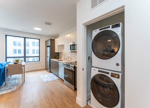 Studio apartment with in home washer and dryer and stainless steel appliances