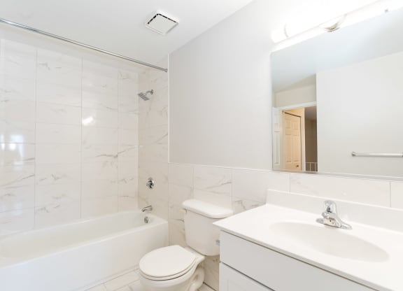 a bathroom with a sink toilet and bathtub
