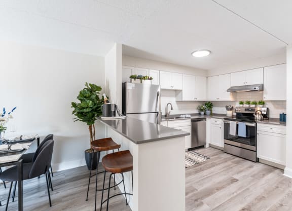 a kitchen and dining area in a 555 waverly unit