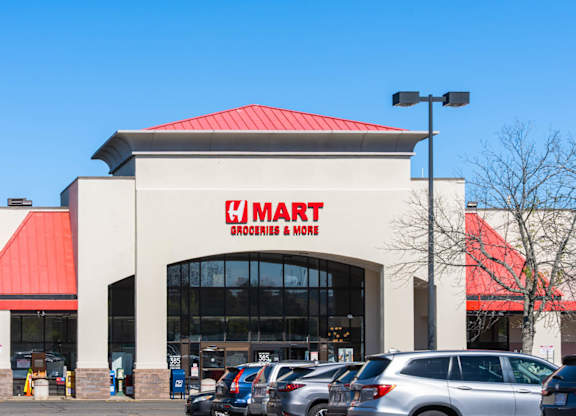 A large store with a red roof and a sign that says
